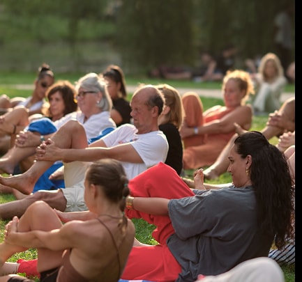 Group practicing Fascial Maneuvers together outdoors in a park